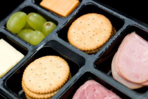 homemade lunchable with meat, dairy free cheese, grapes and wheat free crackers