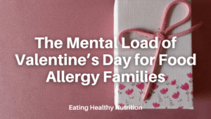 Cloth napkin with Pink tulips tied with a ribbon on a table for a Valentine’s Day reflection on food allergies