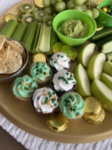 green and white buttercream cupcakes for St Patrick's Day charcuterie board