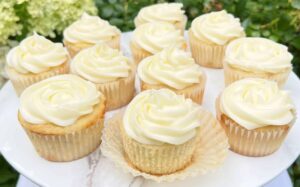 Cupcakes with light frosting on a cake stand, simple dessert option for an Easter dessert board
