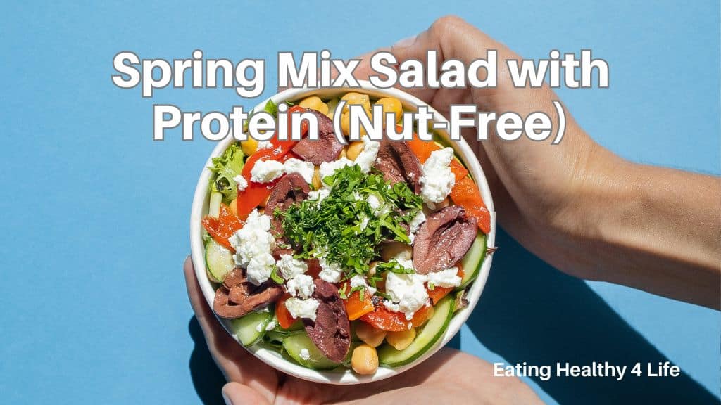 Spring mix salad with chickpeas, vegetables, and cheese in a bowl, nut-free high protein salad