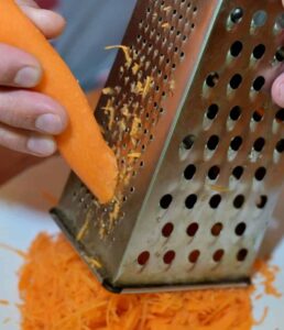 shredding carrot for carrot cake overnight oats