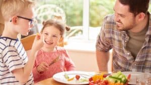 child with food allergies and a picky eater trying a new safe food
