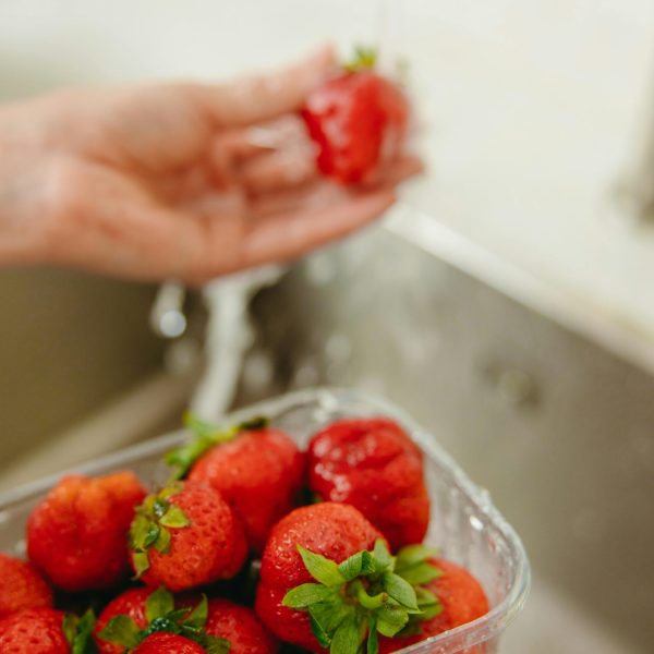 Close Up Photo of Strawberries in Plastic Tray